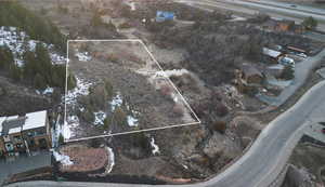 View of property location featuring property parcel outlined and nearby suburban area