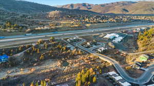Aerial overview of property's location featuring a mountainous background