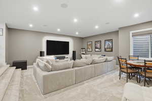 Living room featuring recessed lighting and light colored carpet