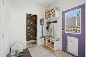 Mudroom featuring light wood-look finished floors