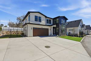 Contemporary house featuring a garage and driveway