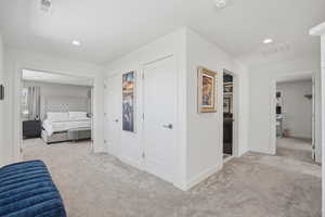 Bedroom featuring light carpet and recessed lighting