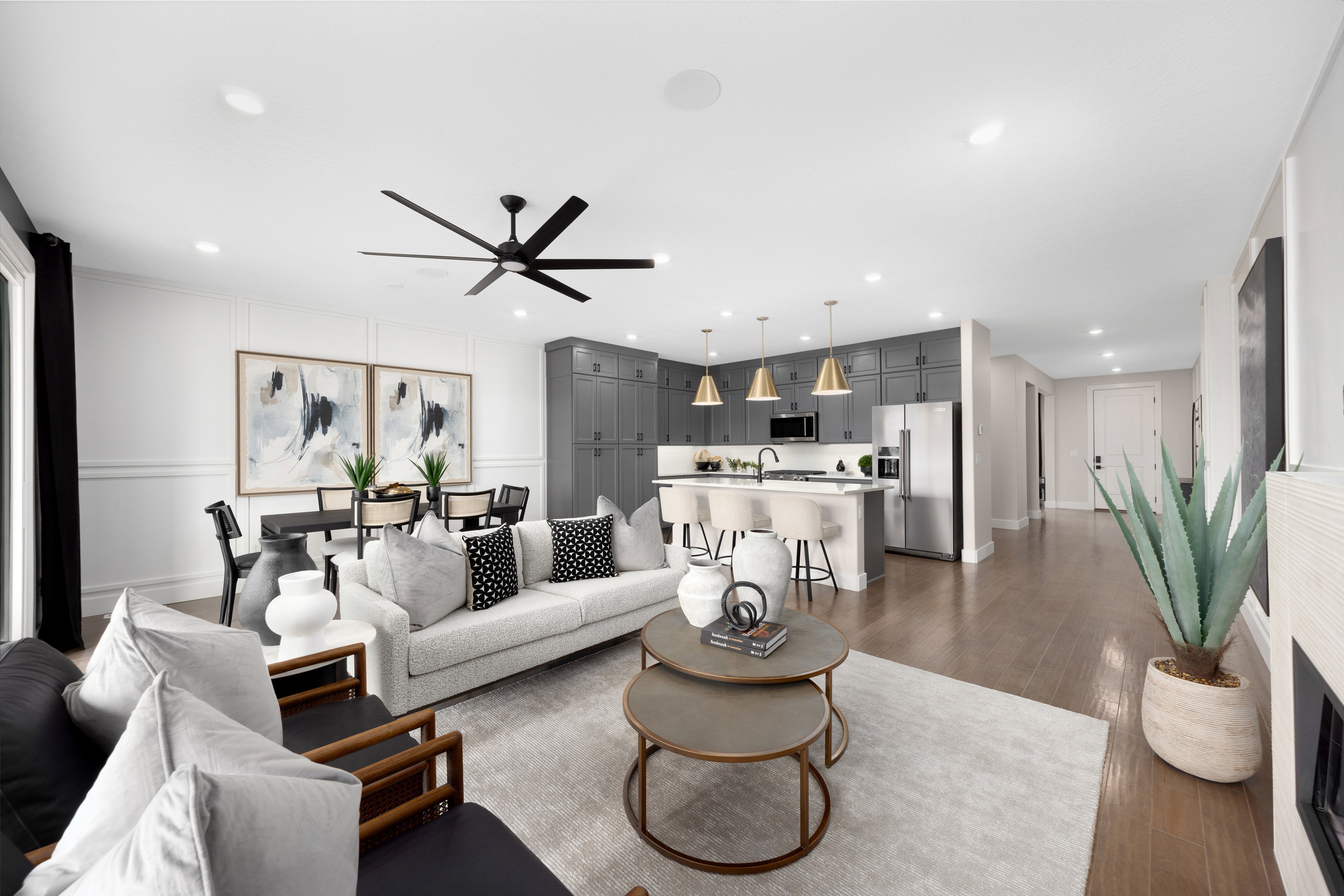 Gathering Room and Kitchen *Actual home may differ in color/material/options. Pictures are of finished homes of the same floor plan and may contain options/upgrades/ decorations/ furnishings not available at the advertised price.