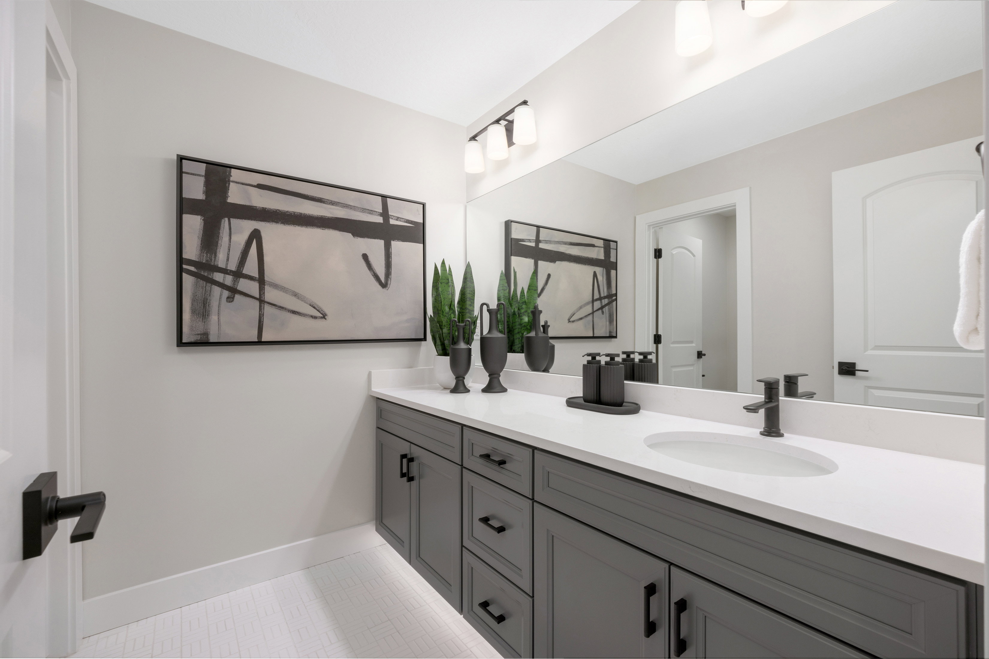 Full bathroom with double vanity  *Actual home may differ in color/material/options. Pictures are of finished homes of the same floor plan and may contain options/upgrades/ decorations/ furnishings not available at the advertised price.