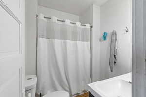 Bathroom with shower / tub combo and vanity