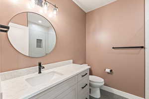 Bathroom with vanity, tile patterned flooring, and a tile shower