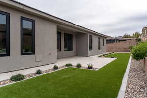 Fenced yard featuring a patio