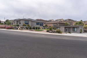 Prairie-style house with stucco siding and a residential view