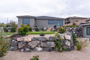 Rear view of house featuring stucco siding