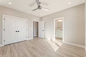 Unfurnished bedroom with light wood-style floors, recessed lighting, ensuite bathroom, ceiling fan, and a closet