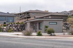View of front of home featuring stucco siding