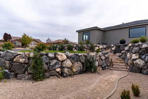 View of yard featuring stairs