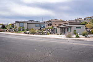 Prairie-style house with stucco siding and stone siding