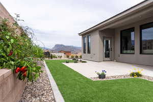 View of yard featuring a mountain view and a patio area