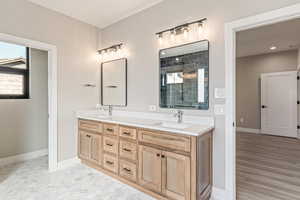 Full bath featuring double vanity and a stall shower