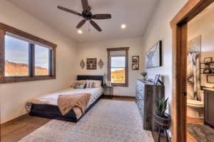Bedroom with recessed lighting, ceiling fan, and ensuite bathroom
