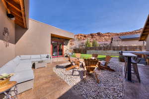 Courtyard featuring an outdoor lounge area with bar and outdoor fire pit