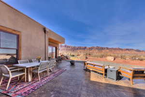 Patio featuring outdoor dining space, Red Rock views, and a built in fire pit