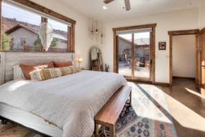 Bedroom featuring access to courtyard and large windows
