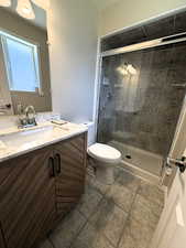 Main Suite Bathroom featuring vanity, a shower stall, and light tile patterned flooring