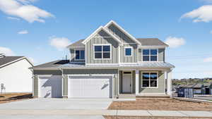 View of front of property featuring board and batten siding, a porch, a shingled roof, and driveway