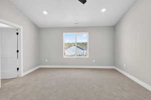 Unfurnished room with light colored carpet, ceiling fan, and recessed lighting