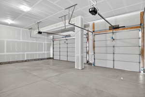 Garage featuring a garage door opener
