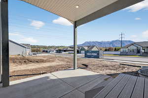 View of patio with a residential view and a mountain view