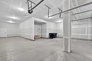 Garage featuring a garage door opener