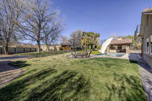 Fenced backyard with a patio area
