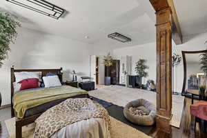 Bedroom with wood finished floors