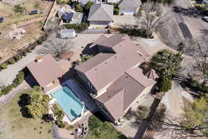 Aerial view of residential area featuring a pool area