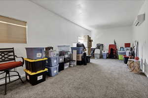 Miscellaneous room featuring carpet and baseboards