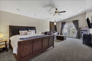 Bedroom featuring french doors, carpet flooring, access to outside, a ceiling fan, and lofted ceiling
