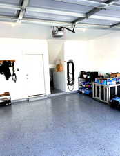 Garage featuring a garage door opener