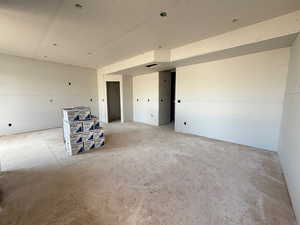 Spare room featuring unfinished concrete floors