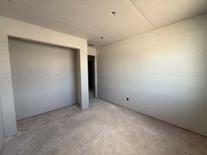 Unfurnished bedroom featuring a closet