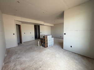 Unfurnished room featuring concrete flooring