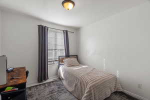 Bedroom featuring baseboards