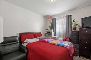 Bedroom featuring a textured ceiling