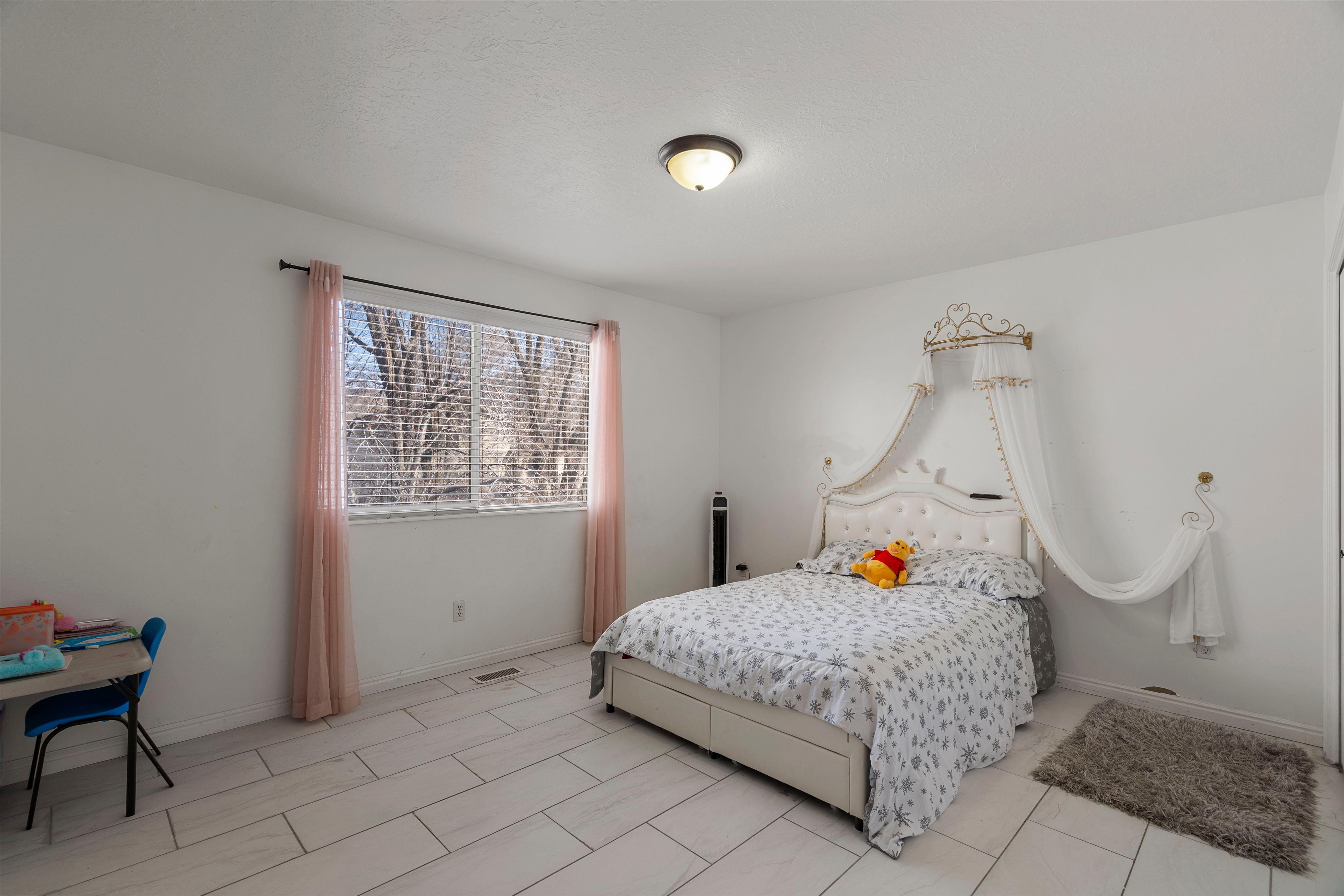 Bedroom featuring baseboards