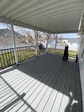 Trex-type deck with a lawn and a residential view