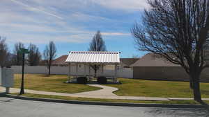 Surrounding community with a patio area and mail area