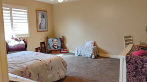 Carpeted bedroom with baseboards