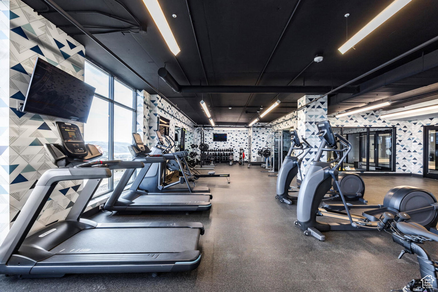 Workout area with wallpapered walls