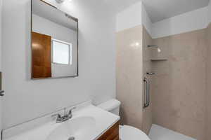 Bathroom with vanity and a shower stall