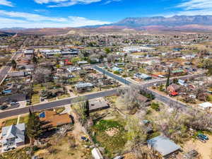 Aerial perspective of suburban area with a mountainous background