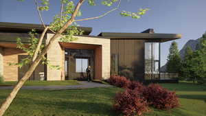 View of front of home featuring a front yard and a mountain view