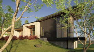 View of side of property with a lawn