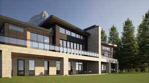 Rear view of property featuring a lawn, a patio area, and a balcony